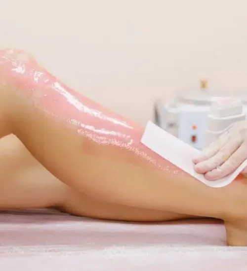 stock-photo-beautician-waxing-female-legs-in-spa-center-627682058-transformed.jpg